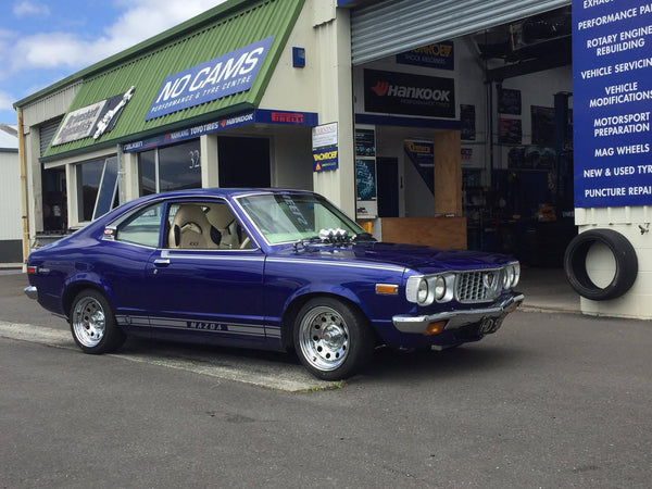 Mazda RX3 coupe fitted up with 14x7 Chrome Modgie wheels wrapped in 195/45r14 Falken tyres